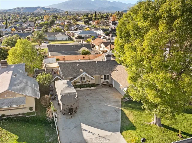 an aerial view of a house with swimming pool and ocean view