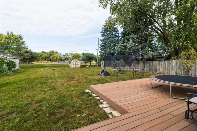 a view of a lake with chairs