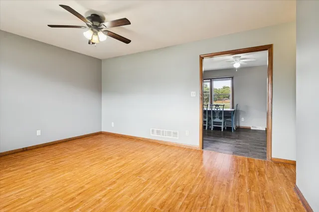 a view of livingroom with hardwood floor and a ceiling fan