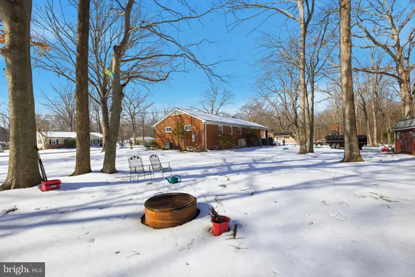 a view of a brick house with potted plants