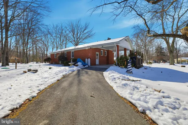 a view of house with a tree