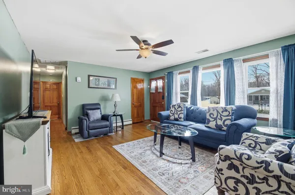 a living room with furniture and a large window