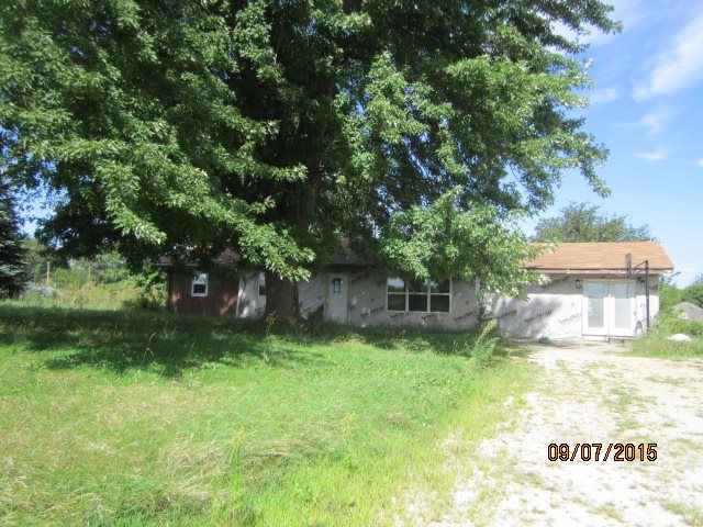 4404 East Walden Road Byron, IL 61010 - Photo 1 of 7 a view of a back yard of the house