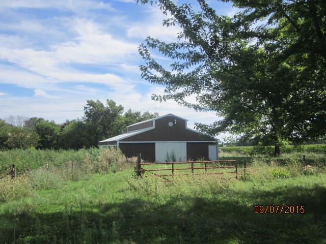 4404 East Walden Road Byron, IL 61010 - Photo 3 of 7 a front view of a house with a yard