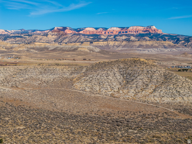 1040 West Under The Rim Road Tropic, UT 84776 - Photo 18 of 21 Expansive desert landscape featuring rolling hills and distant mountains