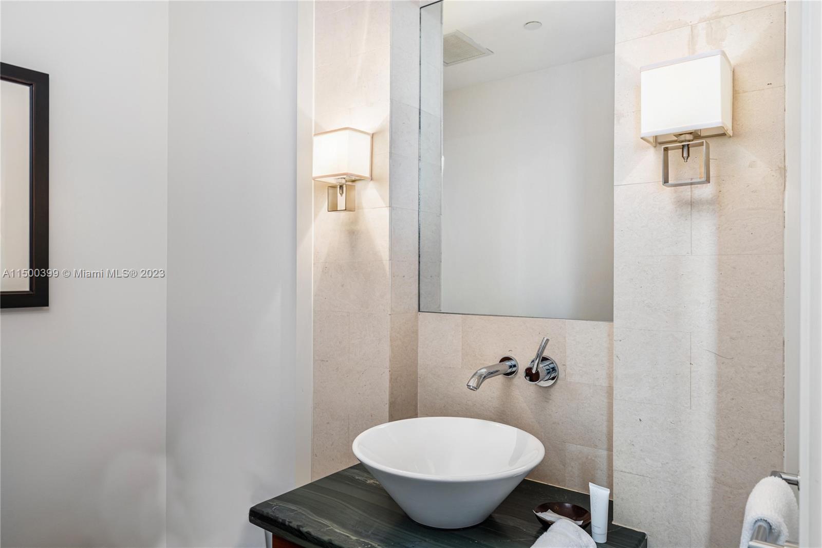 10295 Collins Avenue, Unit 1217 Bal Harbour, FL 33154 - Photo 19 of 26 a bathroom with a toilet and a sink
