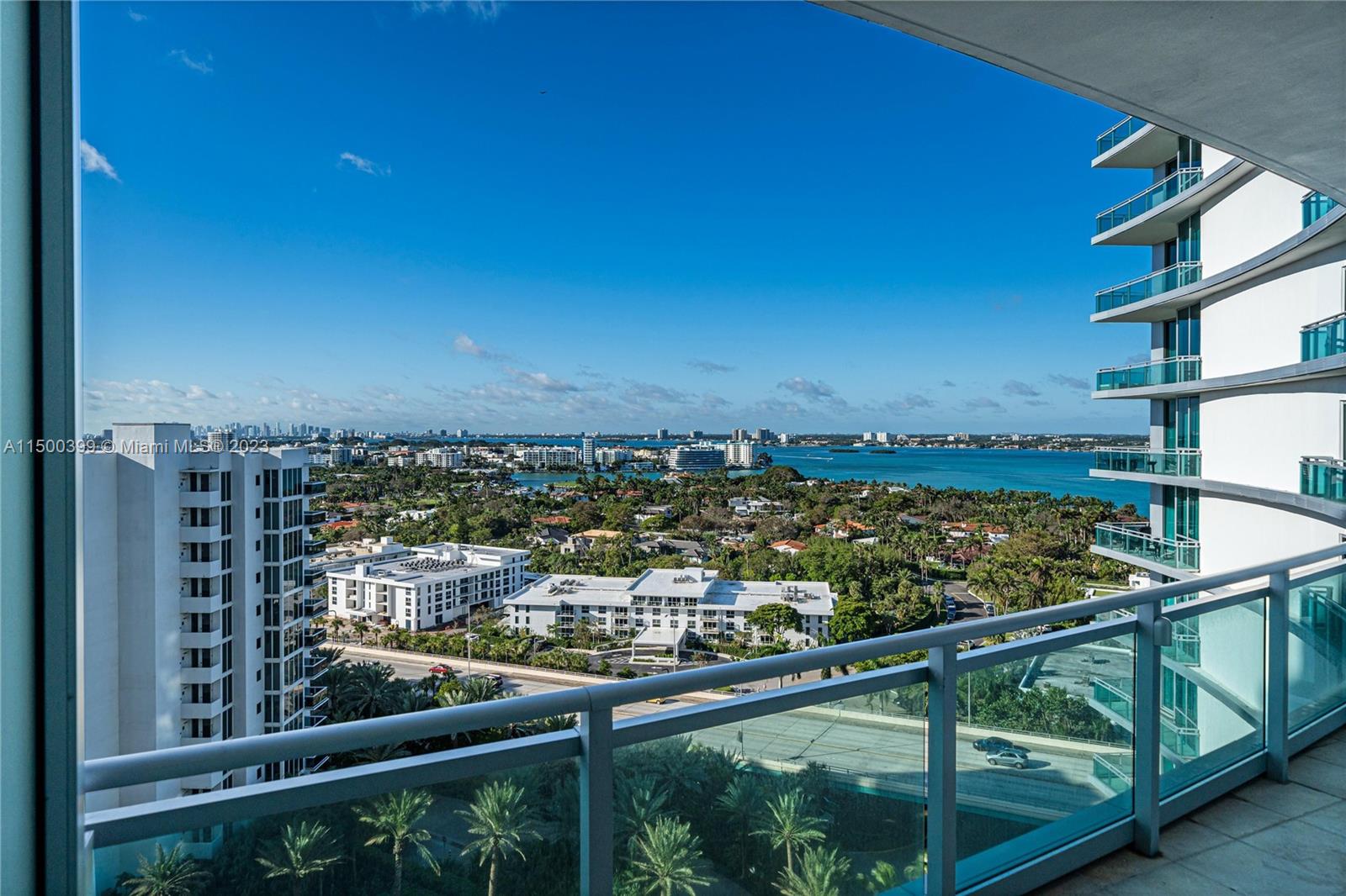 10295 Collins Avenue, Unit 1217 Bal Harbour, FL 33154 - Photo 23 of 26 a view of a lake from a balcony