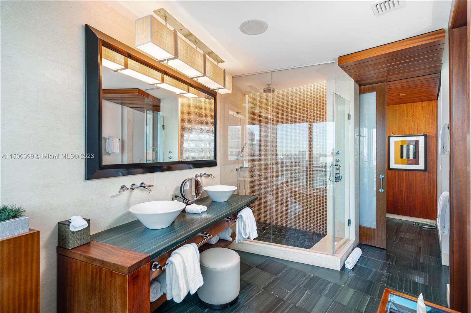 10295 Collins Avenue, Unit 1217 Bal Harbour, FL 33154 - Photo 25 of 26 a bathroom with a sink a toilet and shower