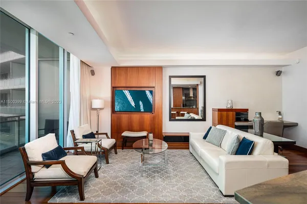 a living room with furniture and a large window