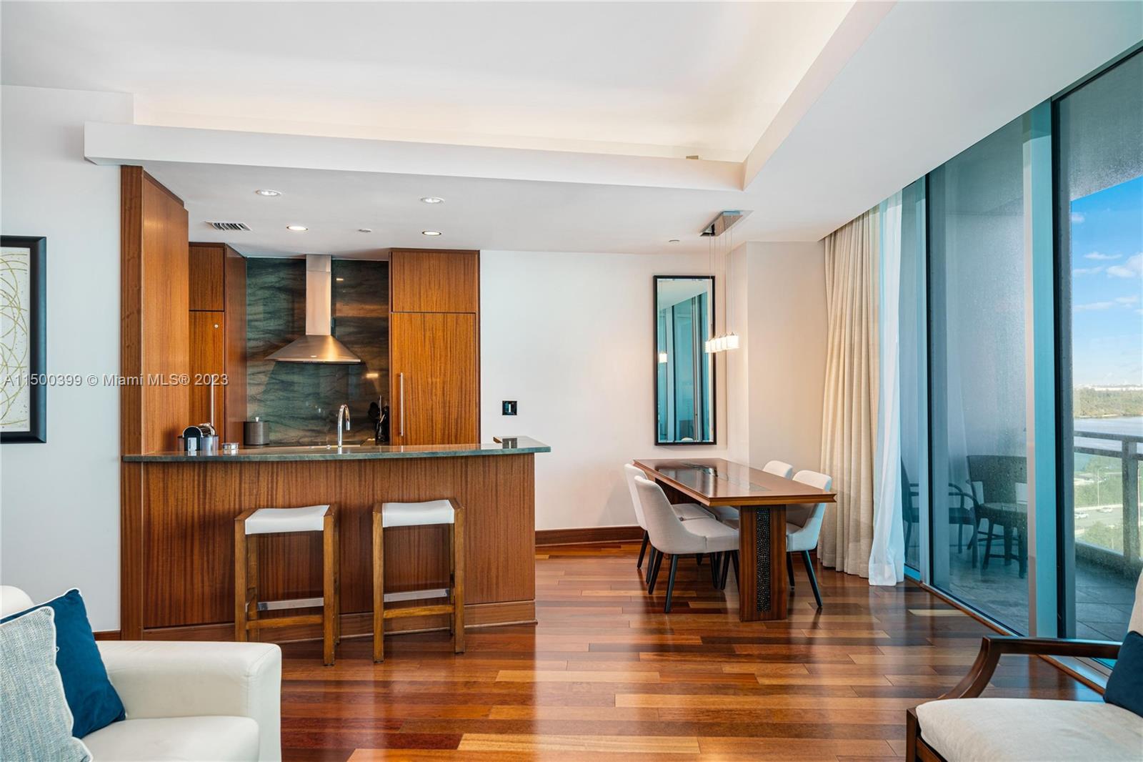 10295 Collins Avenue, Unit 1217 Bal Harbour, FL 33154 - Photo 5 of 26 a living room with fireplace furniture and a large window