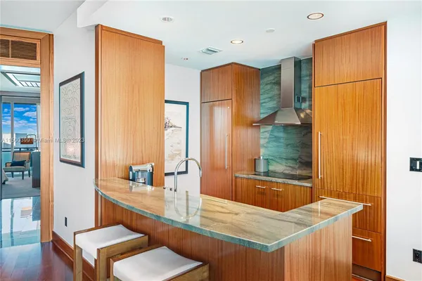 a room with sink refrigerator and window