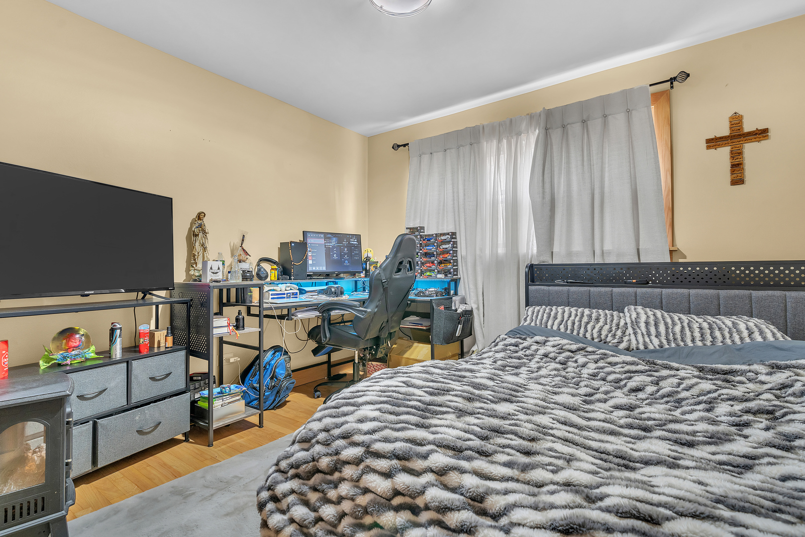 6048 West 79th Street Burbank, IL 60459 - Photo 11 of 34 a bedroom with furniture and a flat screen tv