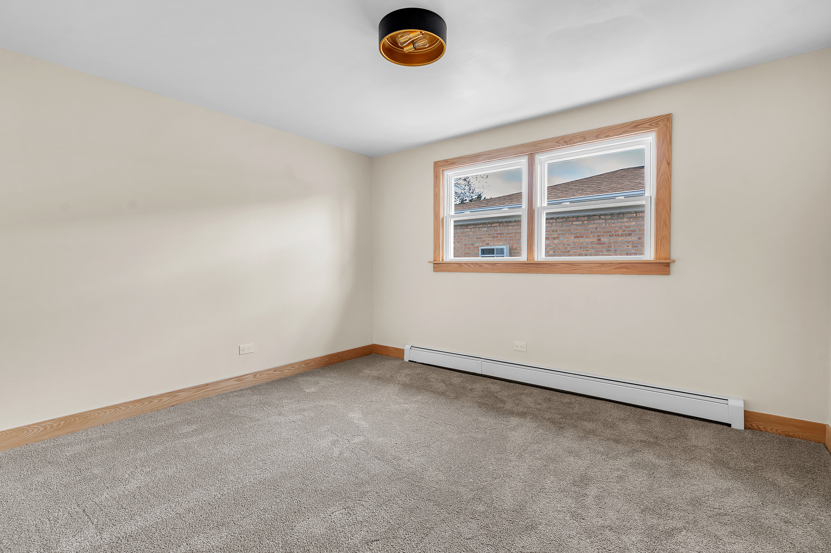 6048 West 79th Street Burbank, IL 60459 - Photo 14 of 34 an empty room with a window