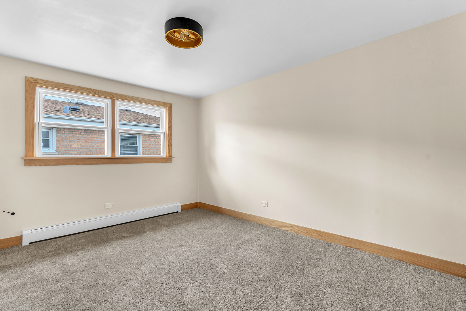 6048 West 79th Street Burbank, IL 60459 - Photo 17 of 34 an empty room with a window