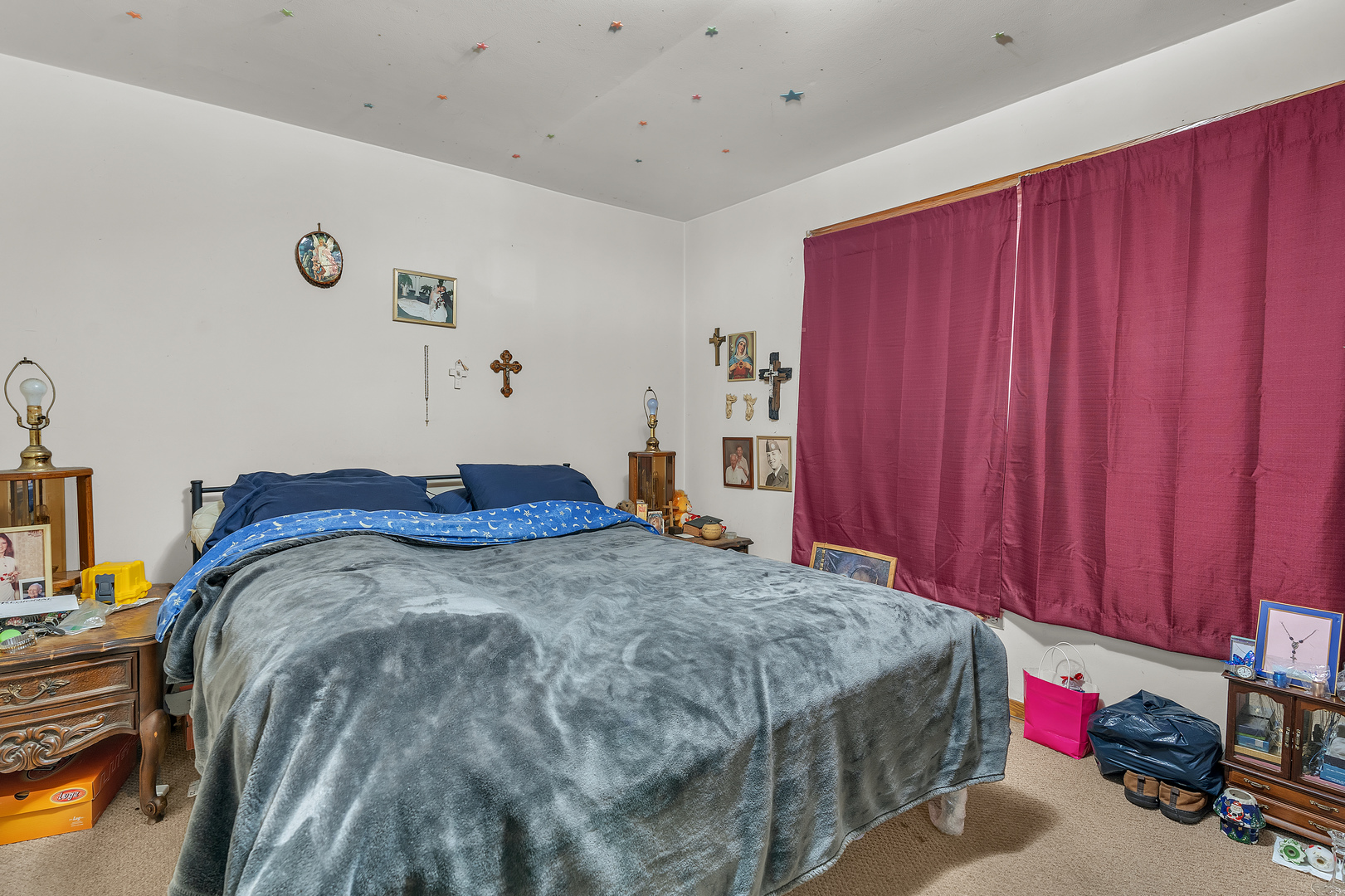 6048 West 79th Street Burbank, IL 60459 - Photo 30 of 34 a bed sitting in a bedroom next to a window