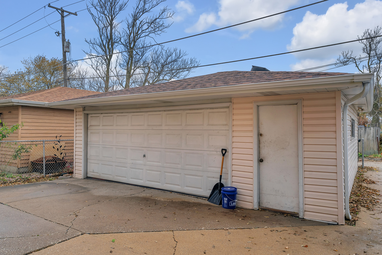 6048 West 79th Street Burbank, IL 60459 - Photo 32 of 34 a view of a house with a garage