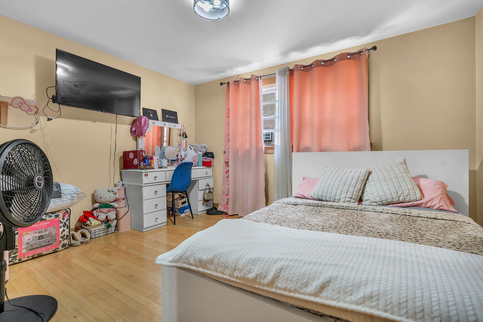 6048 West 79th Street Burbank, IL 60459 - Photo 7 of 34 a bedroom with a bed and a flat tv screen