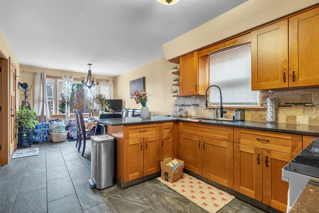 a kitchen with a sink and a refrigerator