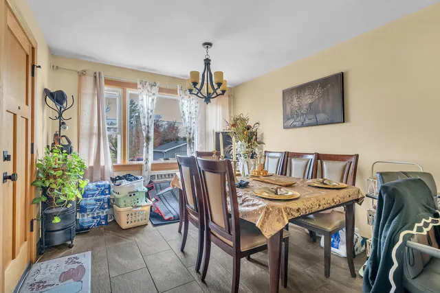 a dining room with furniture and window