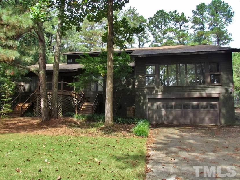 224 Bayleaf Drive Raleigh, NC 27615 - Photo 1 of 22 a front view of a house with a yard