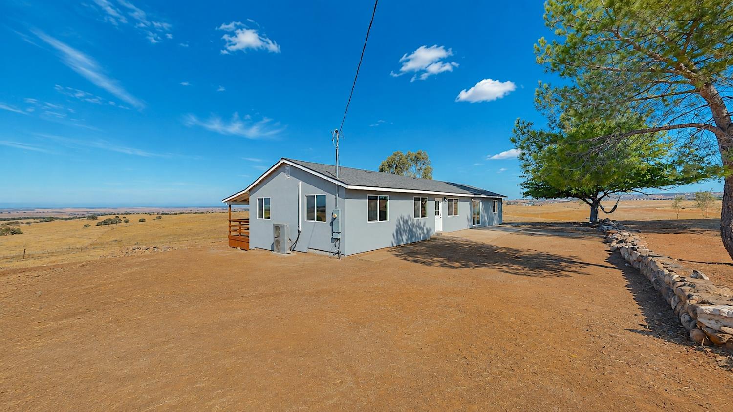 4728 Zorro Road La Grange, CA 95329 - Photo 2 of 56 Front Side View. Gray exterior, multiple windows, and a side deck