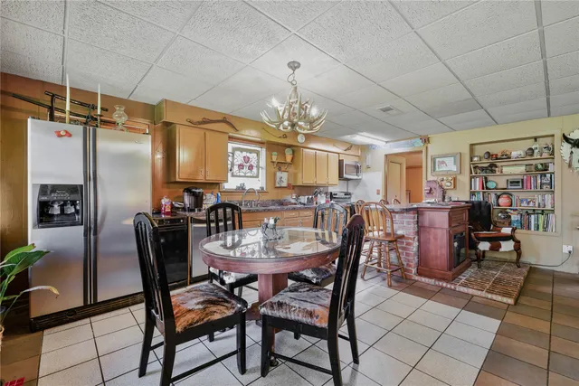 a kitchen with stainless steel appliances a sink and cabinets