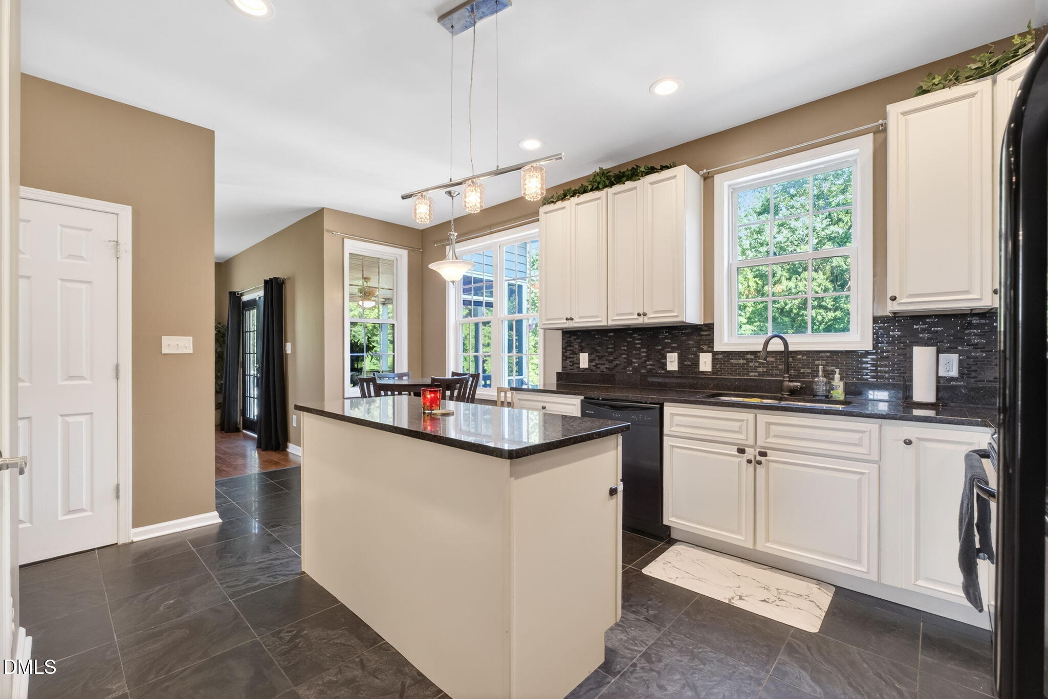 923 White Memorial Church Road Willow Spring, NC 27592 - Photo 18 of 46 a kitchen with sink a window and cabinets