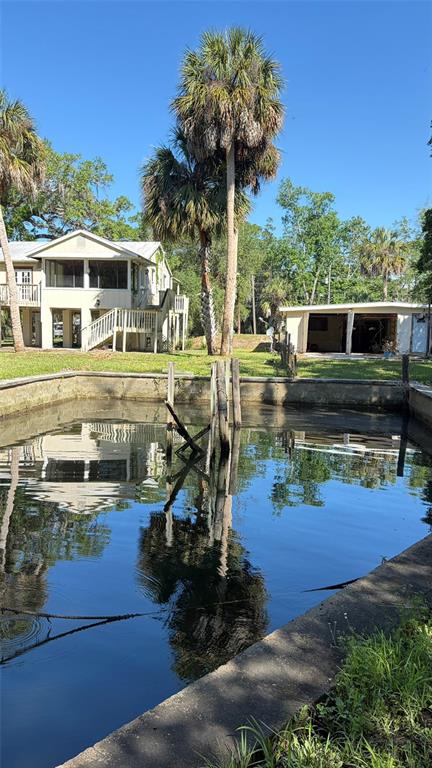 6601 Riverside Drive Yankeetown, FL 34498 - Photo 12 of 16 a view of a house with pool yard and outdoor seating