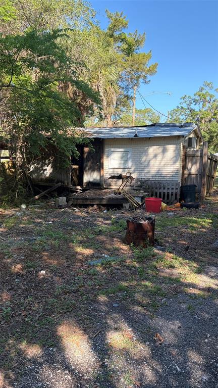 6601 Riverside Drive Yankeetown, FL 34498 - Photo 3 of 16 a backyard of a house with yard and furniture