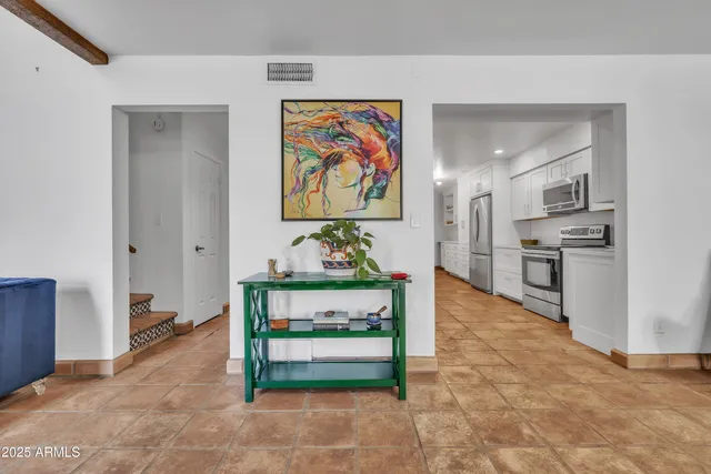 a view of living room with furniture and window