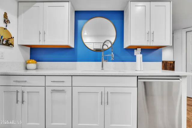 a kitchen with cabinets and window