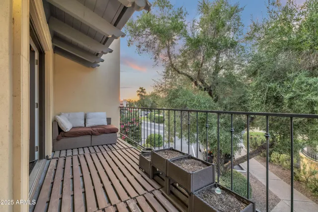 a balcony with wooden floor