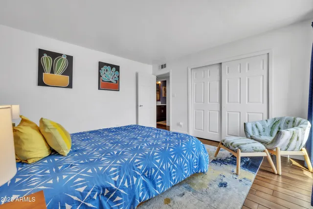 a bedroom with a bed and a couch