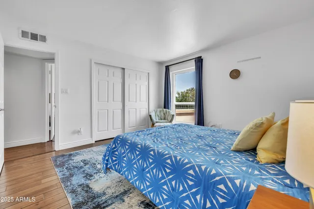 a bedroom with a bed and a dresser