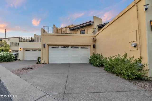 a front view of a house with garage