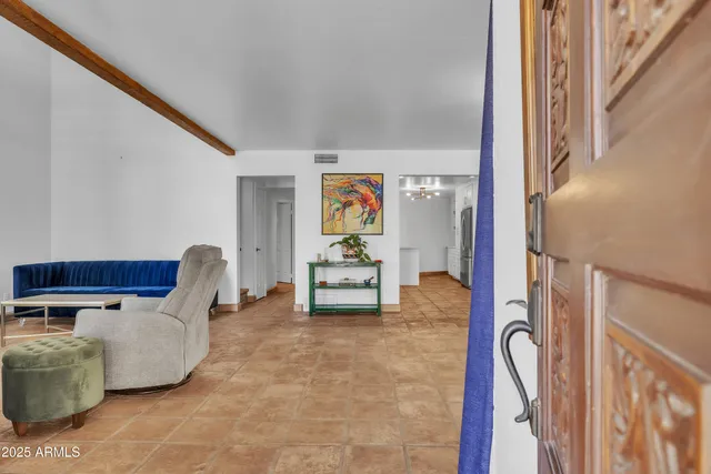 a view of living room with furniture and a window