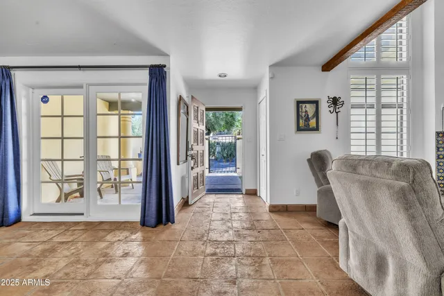 a view of a livingroom with furniture and windows
