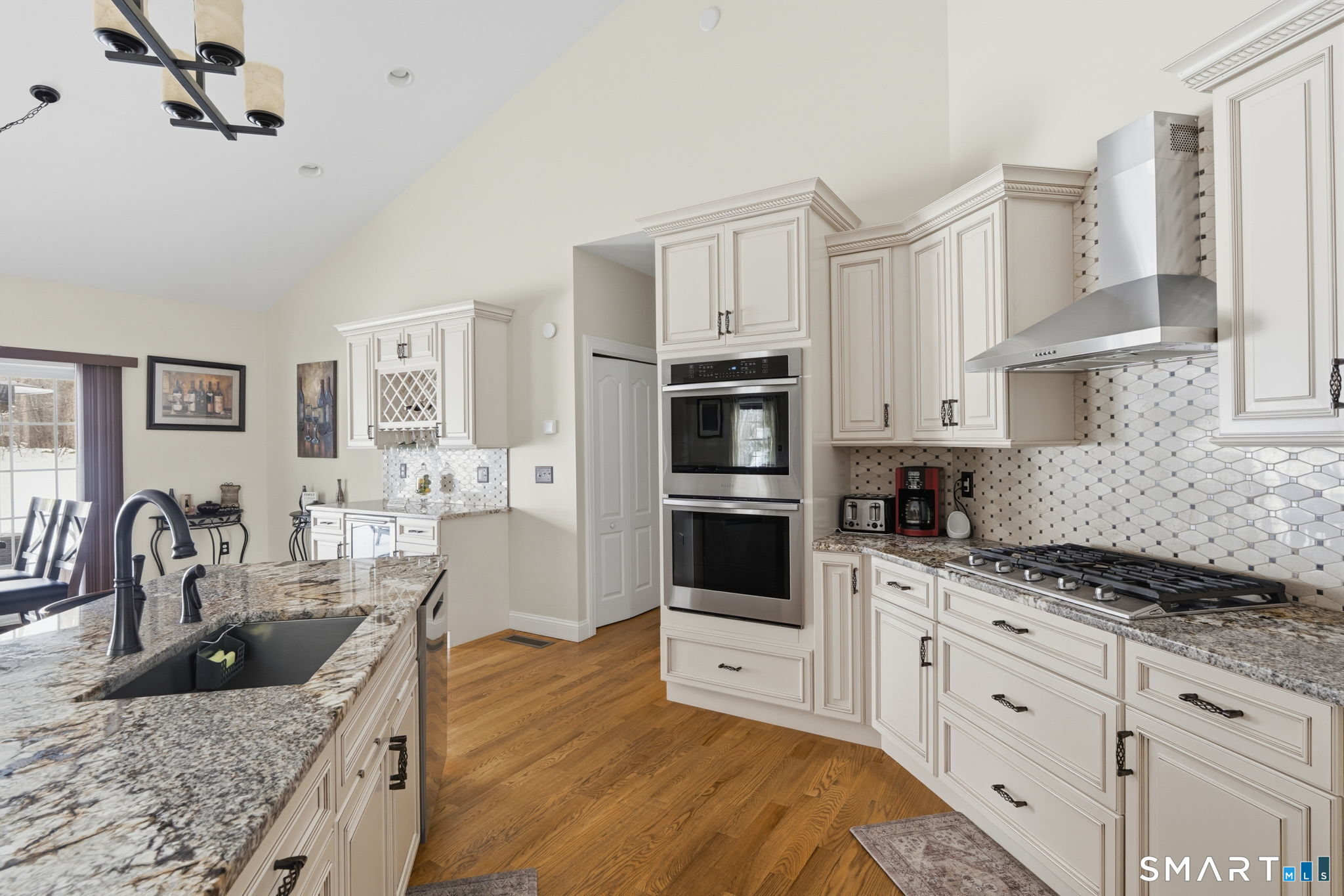 16 Crystal Brook Road Wolcott, CT 06716 - Photo 18 of 40 a kitchen with granite countertop a sink a counter space appliances and cabinets
