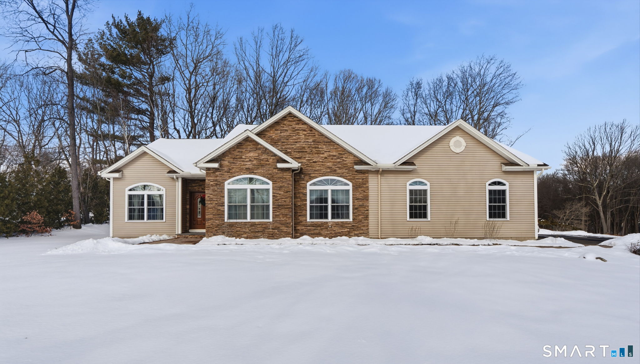 16 Crystal Brook Road Wolcott, CT 06716 - Photo 2 of 40 a front view of a house with a yard covered in snow