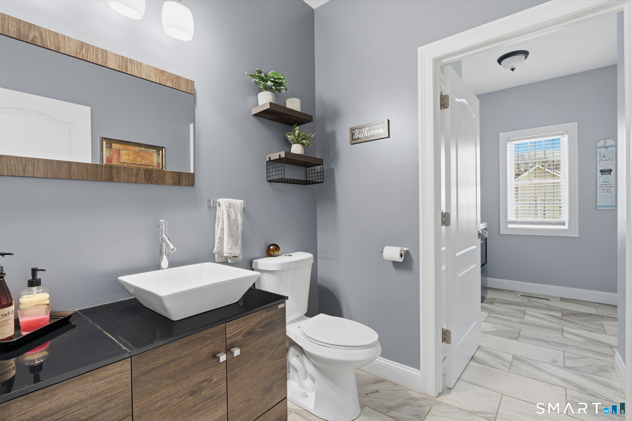 16 Crystal Brook Road Wolcott, CT 06716 - Photo 23 of 40 a bathroom with a sink a toilet and shower curtain
