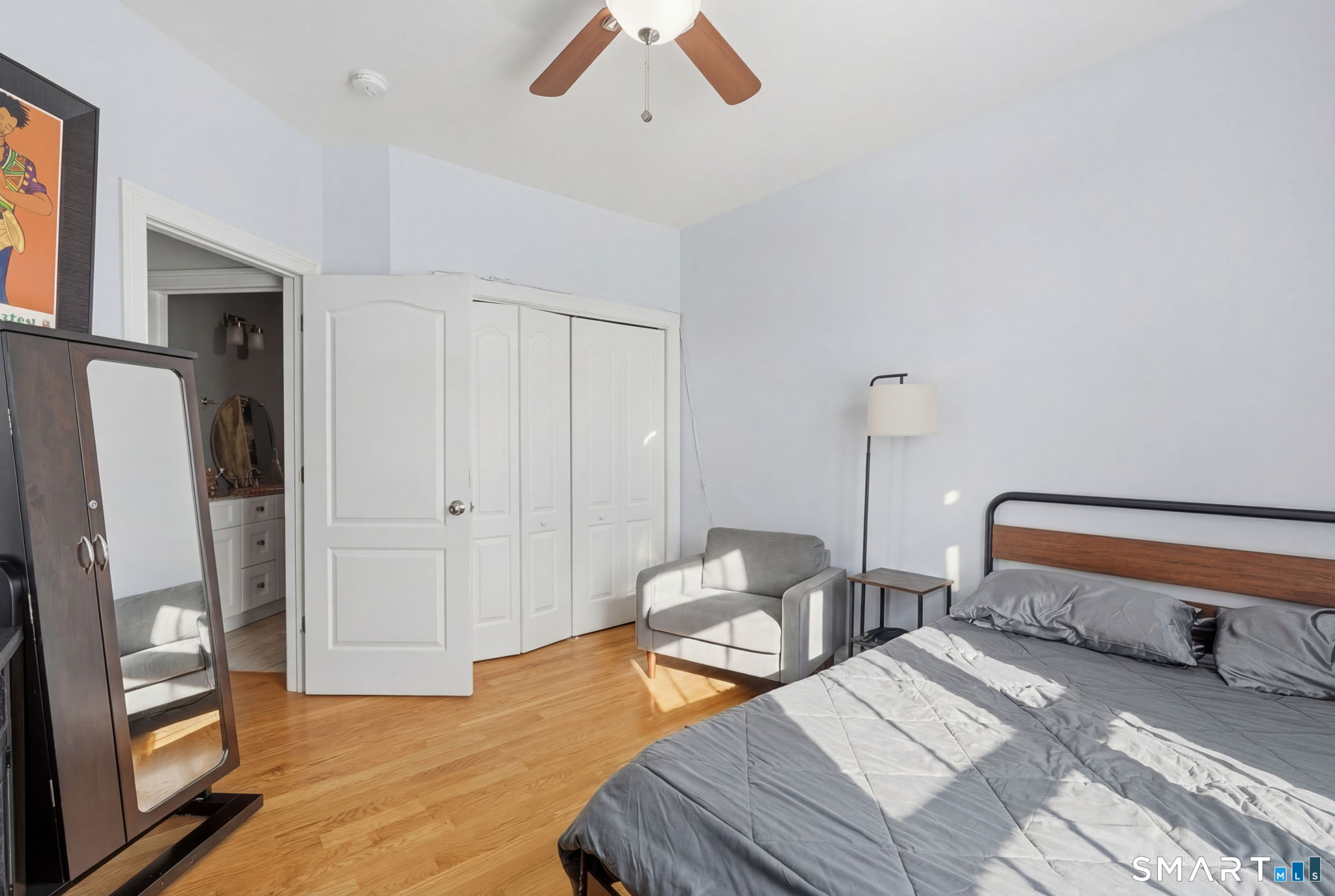 16 Crystal Brook Road Wolcott, CT 06716 - Photo 30 of 40 a bedroom with a bed and a refrigerator