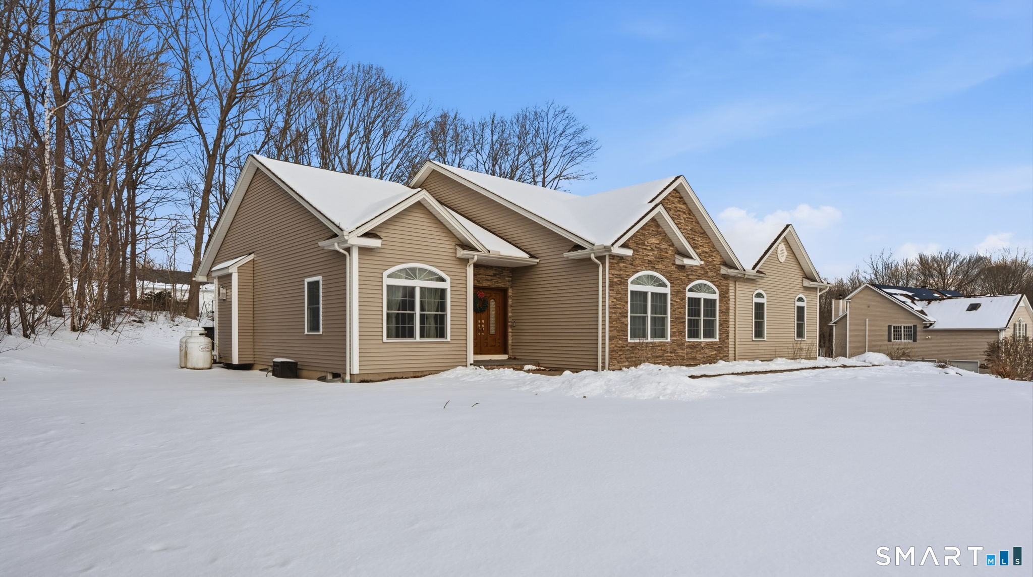 16 Crystal Brook Road Wolcott, CT 06716 - Photo 3 of 40 a view of a house with a yard covered in snow