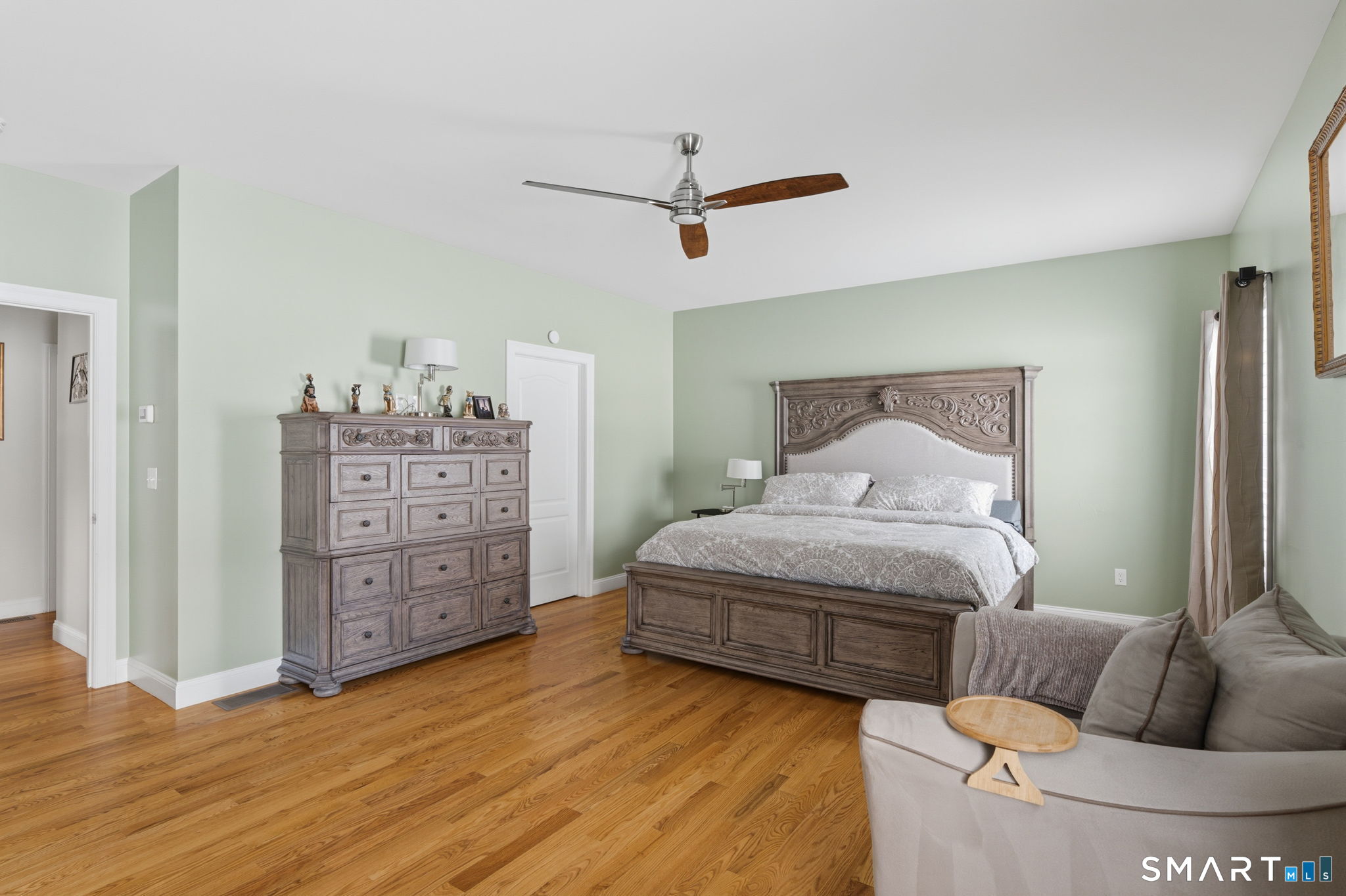 16 Crystal Brook Road Wolcott, CT 06716 - Photo 32 of 40 a bedroom with a bed and ceiling fan
