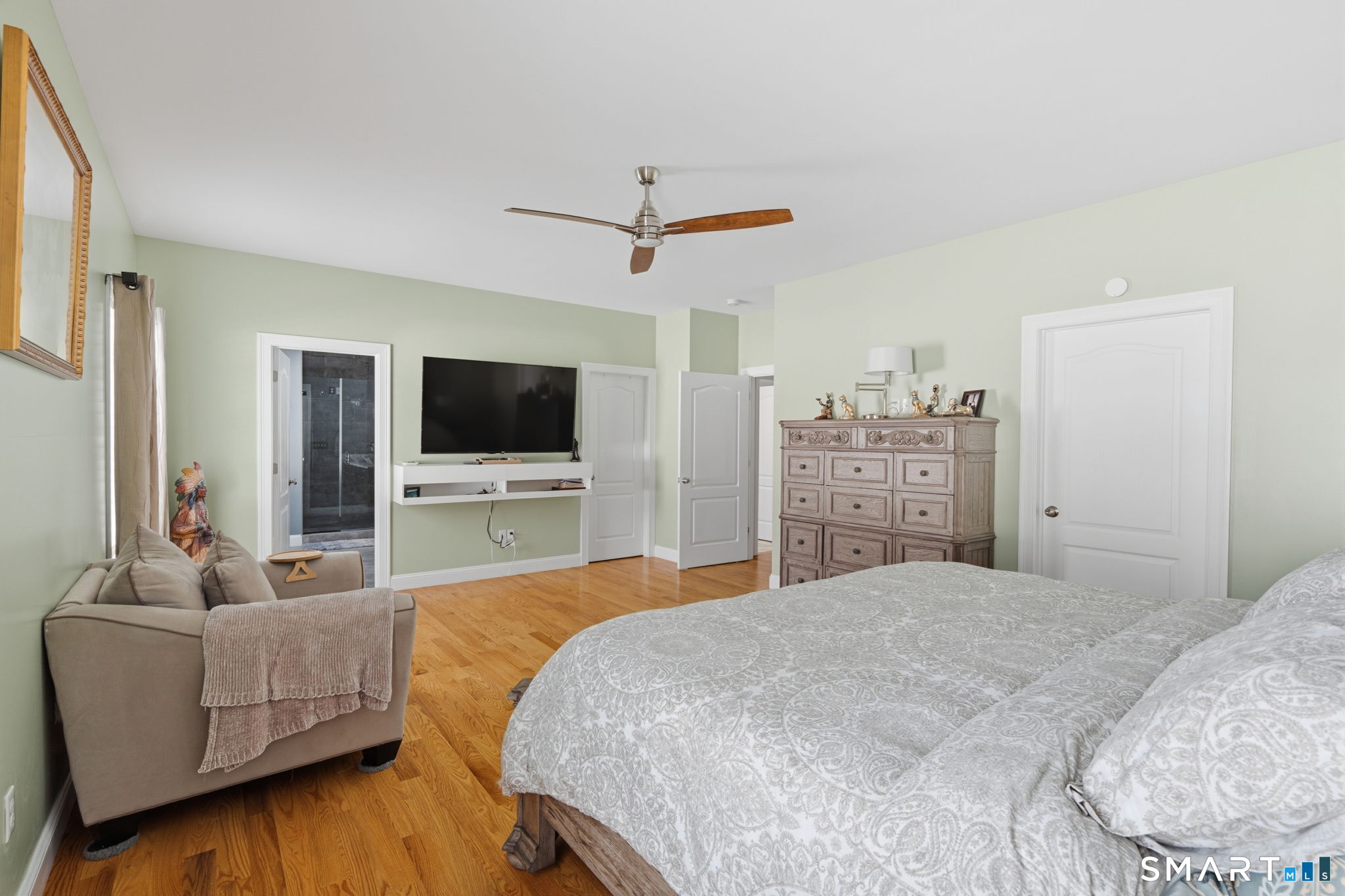 16 Crystal Brook Road Wolcott, CT 06716 - Photo 33 of 40 a bedroom with a bed and a flat screen tv