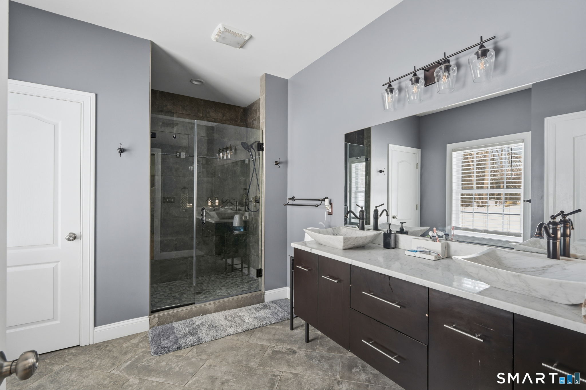 16 Crystal Brook Road Wolcott, CT 06716 - Photo 34 of 40 a bathroom with a double vanity sink mirror and shower