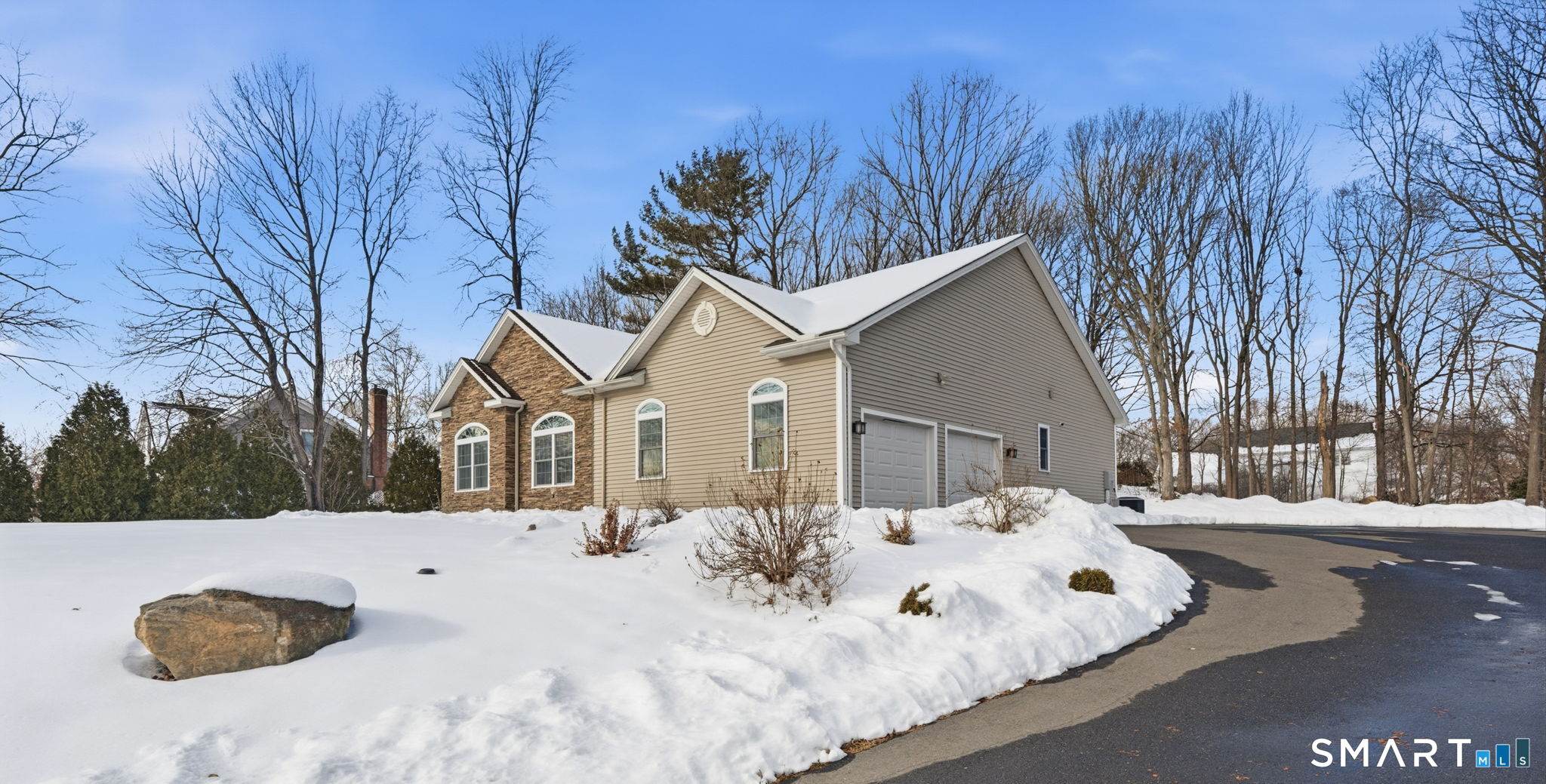 16 Crystal Brook Road Wolcott, CT 06716 - Photo 37 of 40 a view of white house with a yard covered in snow