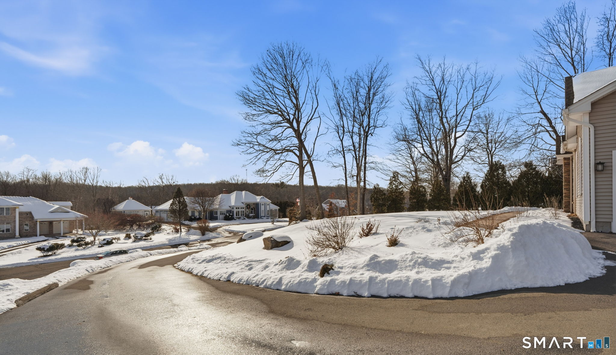 16 Crystal Brook Road Wolcott, CT 06716 - Photo 38 of 40 a view of a house with a snow on the road