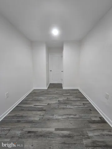 a view of room and wooden floor