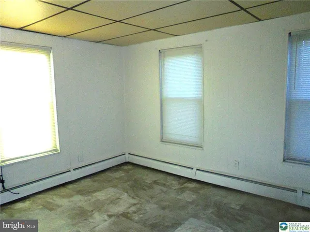 a view of a room that has a window in it