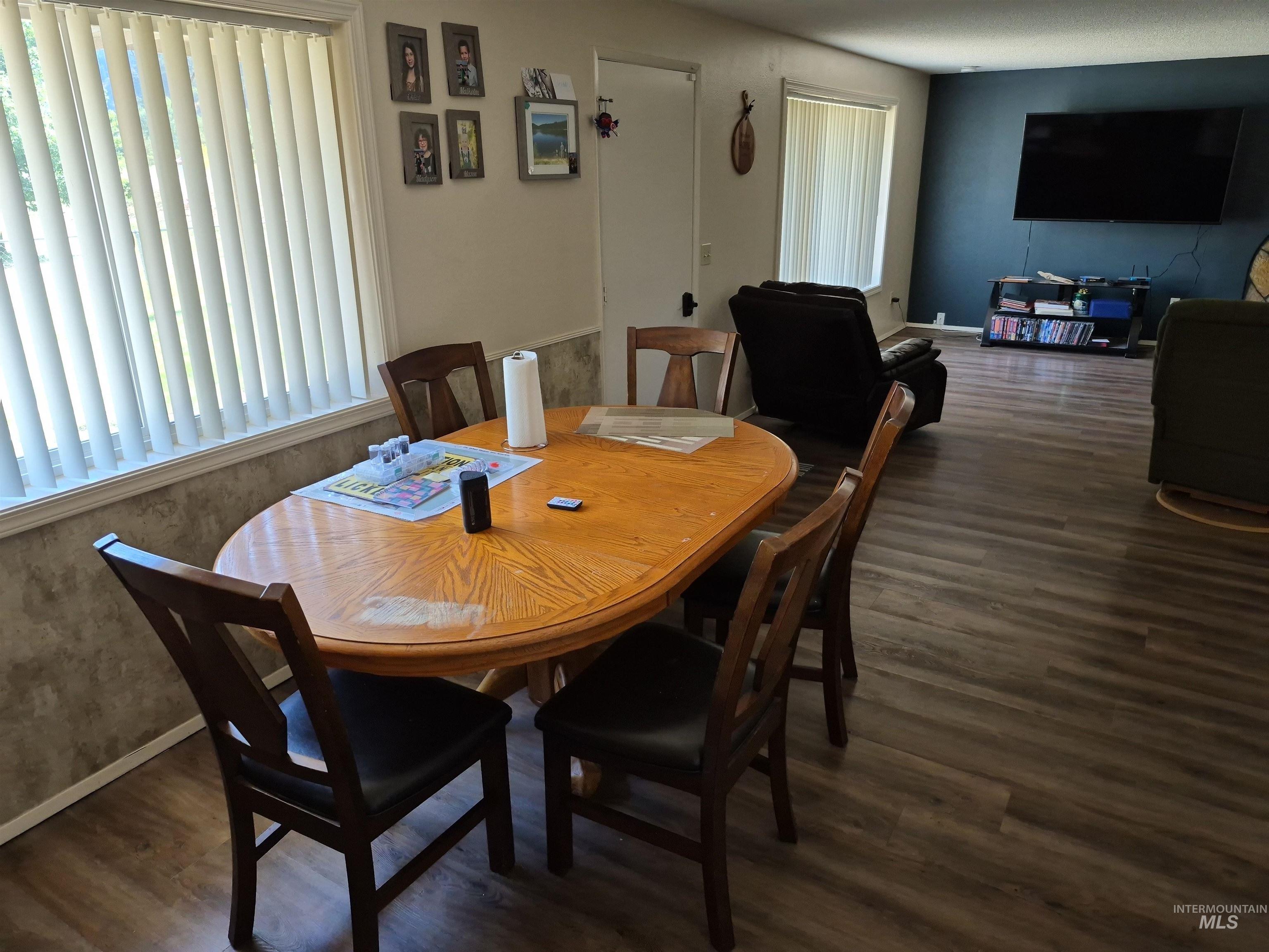 701 Wheeler Street Kendrick, ID 83537 - Photo 13 of 32 Dining area featuring dark wood-style flooring and baseboards